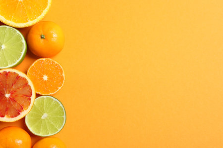 Different citrus fruits on color background, flat lay. Space for textの写真素材