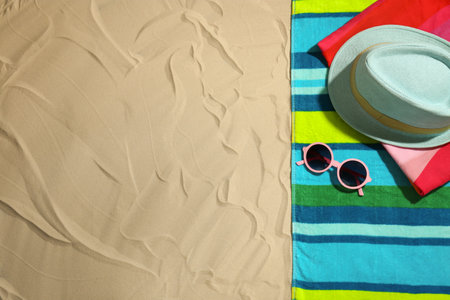 Flat lay composition with beach objects and space for text on sandの写真素材
