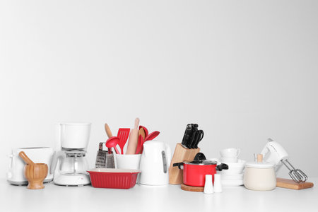 Set of clean cookware, dishes, utensils and appliances isolated on whiteの写真素材