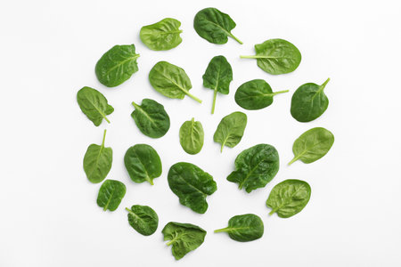Fresh leaves of spinach isolated on white, top viewの写真素材