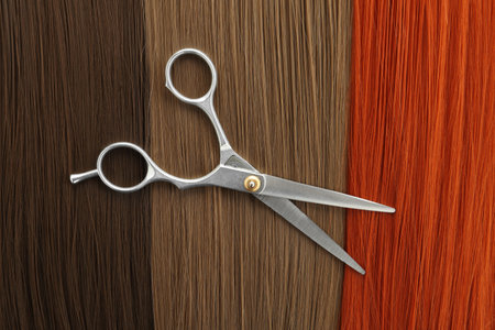 Scissors on hair, top view. hairdresser serviceの写真素材