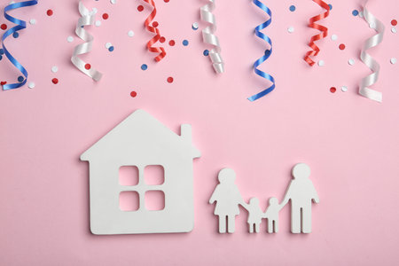 Flat lay composition with house and family figures on color background. USA Independence Dayの写真素材