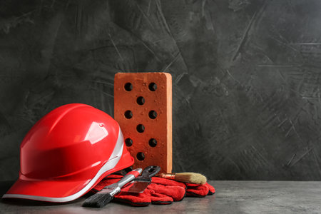 Composition with construction tools on gray table, space for textの写真素材