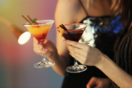 Young women with martini cocktails in bar, closeupの写真素材