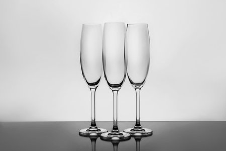Empty clear champagne glasses on white backgroundの写真素材