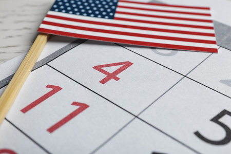 Composition with USA flag and calendar on table, closeup. Happy Independence Day