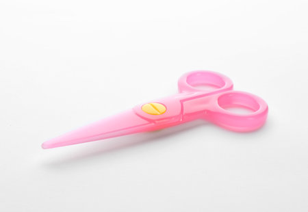 Colorful plastic scissors on white background. school stationeryの写真素材