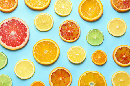 Different citrus fruits on color background, flat layの写真素材