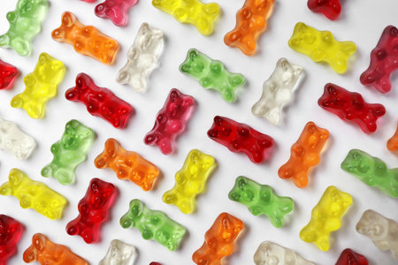 Many delicious little jelly bears on white background, top viewの写真素材