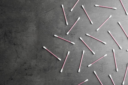 Flat lay composition with cotton swabs on gray background. Space for textの写真素材