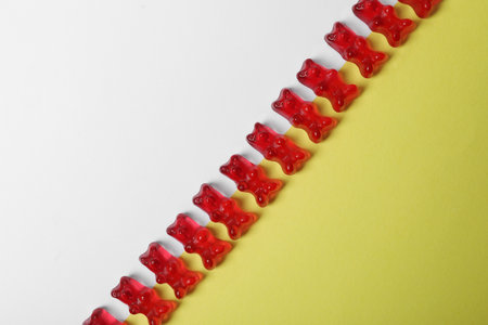 Delicious jelly bears on color background, top viewの写真素材