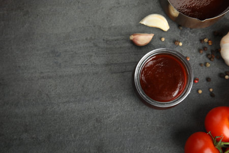 Flat lay composition with barbecue sauce on gray background. Space for textの写真素材