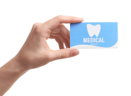 Woman holding business card isolated on white, closeup. dental medical serviceの写真素材