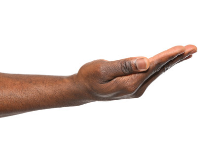 African-American man holding something in hand on white background, closeupの写真素材