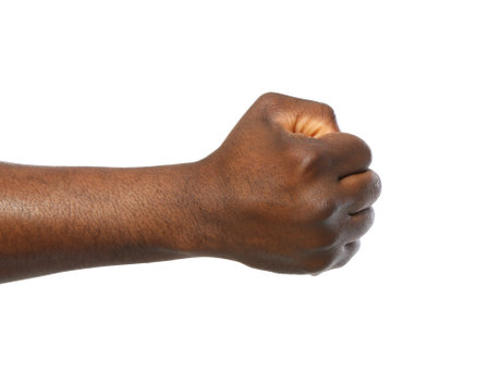 African-American man showing fist on white background, closeupの写真素材