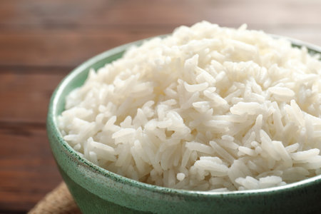 Bowl of tasty cooked white rice on table, closeupの写真素材