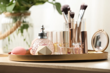 Tray with different makeup products and accessories on dressing tableの写真素材