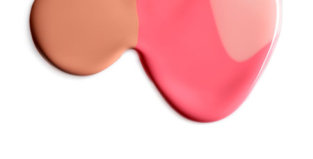 Different color nail polishes flowing on white backgroundの写真素材