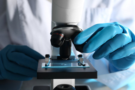 Scientist working with modern microscope, closeup. chemical researchの写真素材