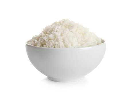 Bowl of tasty cooked rice on white backgroundの写真素材