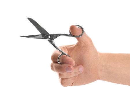 Man holding pair of sewing scissors isolated on white, closeupの写真素材