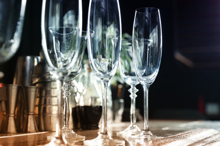 Different empty clean glasses on counter in bar, closeupの写真素材
