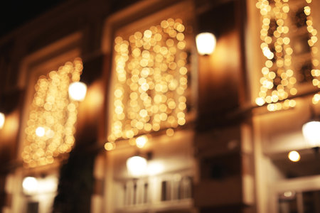 Blurred view of building with beautiful street lights at night. bokeh effectの写真素材
