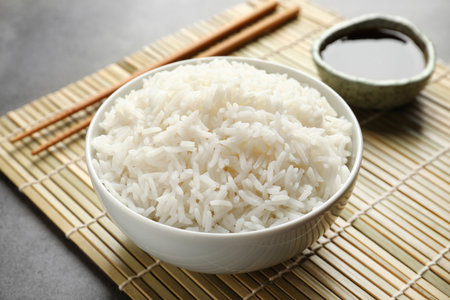 Bowl of tasty cooked rice served on tableの写真素材