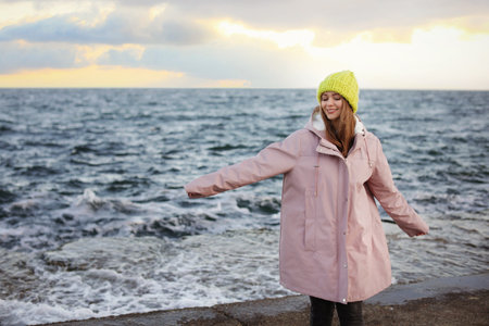 Portrait of a beautiful young woman near the sea