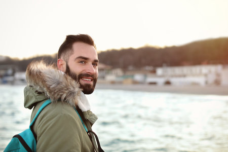 Stylish young man with backpackの写真素材