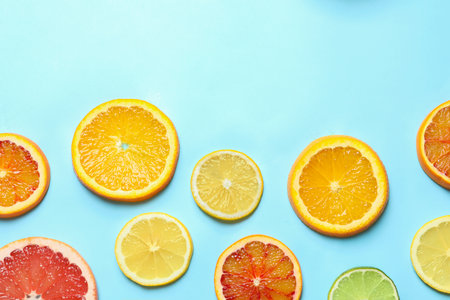 Different citrus fruits on color background, flat lay. Space for textの写真素材