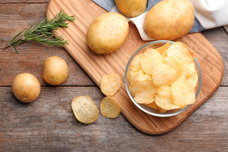 Flat lay composition with potato chips on tableの写真素材