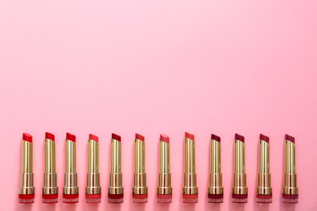 Flat lay composition with different lipsticks on color background, space for textの写真素材