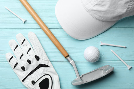 Flat lay composition with golf accessories on blue wooden backgroundの写真素材