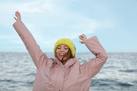 Stylish young woman spending time near the seaの写真素材