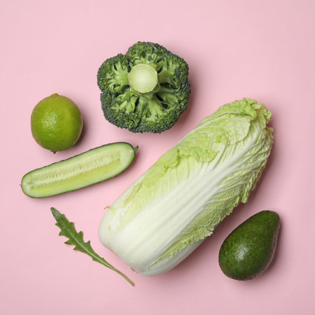 Flat lay composition with fresh ripe vegetables on color backgroundの写真素材
