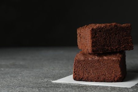Fresh brownies on table, space for text. Delicious chocolate pieの写真素材