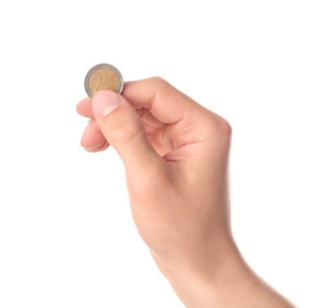 Man holding coin in hand on white background, closeupの写真素材
