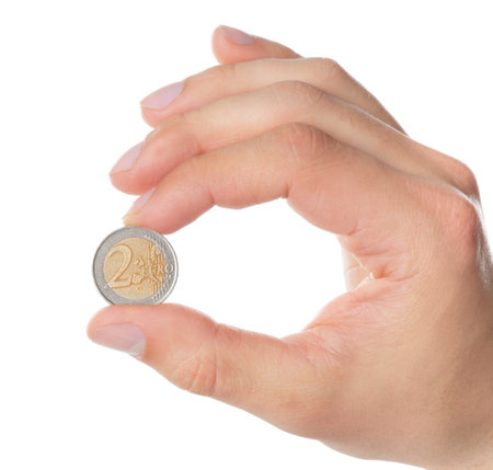 Man holding coin in hand on white background, closeupの写真素材