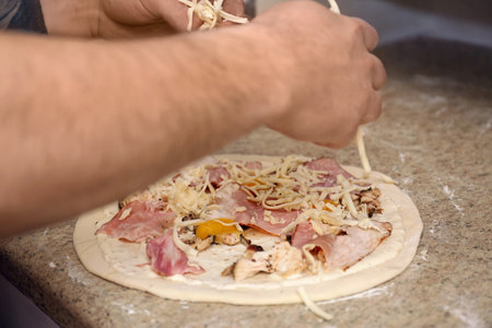 Man preparing pizza at table, closeup. Oven recipeの写真素材