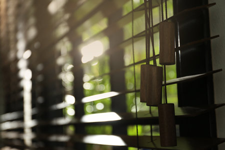 Closeup view of sunlit horizontal window blindsの写真素材