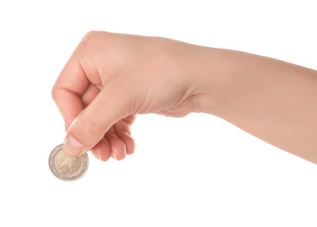 Woman holding coin in hand on white background, closeupの写真素材