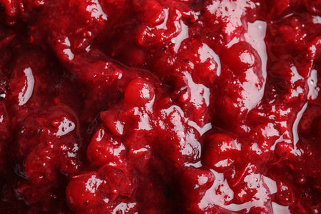 Tasty cranberry sauce as background, closeup viewの写真素材