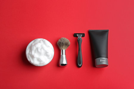 Set of shaving equipment and men's cosmetic products on color background, flat layの写真素材