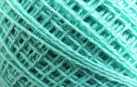 Clew of knitting threads as background, top view. Sewing stuff