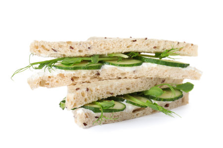 Fresh tasty cucumber sandwiches isolated on whiteの写真素材