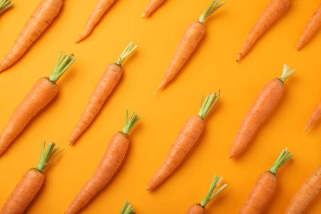 Flat lay composition with fresh carrots on color backgroundの写真素材