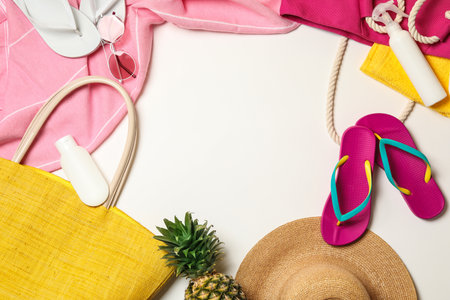 Flat lay composition with beach accessories on white background. Space for textの写真素材