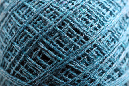 Clew of knitting threads as background, top view. Sewing stuff