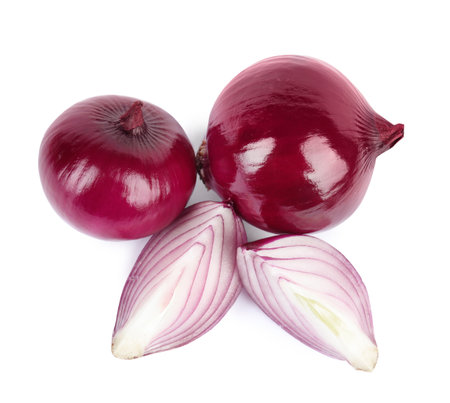 Fresh whole and cut red onions on white background, top viewの写真素材